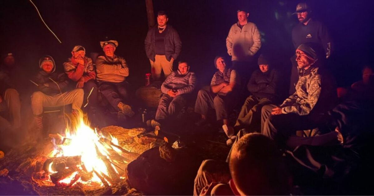 mens-hiking-ministry-sitting-by-fire